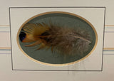 feather detail in oval aperture by artist nigel hemming